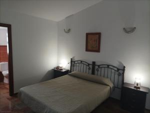 Postel nebo postele na pokoji v ubytování Hostal San Cayetano