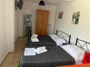 Postel nebo postele na pokoji v ubytování lazari Rooms