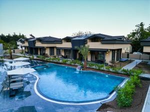an image of a swimming pool at a resort at Minta Hills Villas Kemer in Antalya