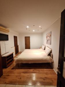 Posteľ alebo postele v izbe v ubytovaní AMMA rooms
