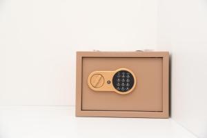 a wooden box with a remote control in it at Villa Rosa in Durrës