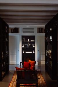 a living room with a couch and some shelves at Casa TOMA - Luxury Garden House in Arzignano