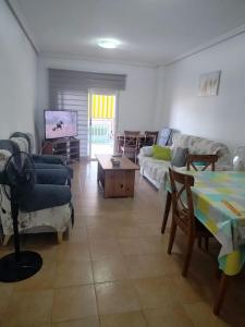 a living room with a couch and a table at Apartment Cala Dor in El Campello