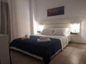 Postel nebo postele na pokoji v ubytování Alana apartment