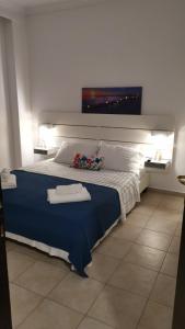 Postel nebo postele na pokoji v ubytování Alana apartment