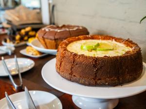 a chocolate cake on a plate on a table at Vale das Orquídeas Pousada in Socorro