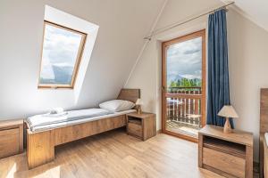 Posteľ alebo postele v izbe v ubytovaní Willa Serafin-basen, sauny i jacuzzi