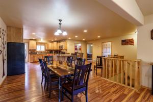 a dining room and kitchen with a table and chairs at Custer Connection in Nihart
