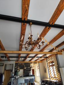 a chandelier hanging from the ceiling of a room at Apartament Deluxe w centrum Brzeska nr 2 in Brzesko