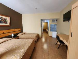 TV a/nebo společenská místnost v ubytování Hotel El Brujo Centro Histórico
