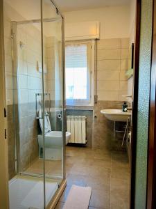 a bathroom with a shower and a toilet and a sink at Blue Deluxe Venice in Mestre +55 photos