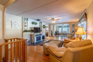 a living room with two couches and a tv at Prairie Creek Cabin w/Hot tub in Rapid City
