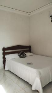 Ein Bett oder Betten in einem Zimmer der Unterkunft Pousada & Camping Recanto dos Anjos Azuis