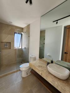 a bathroom with a sink and a toilet and a shower at Casa de Lujo con Jacuzzi in Querétaro +22 photos
