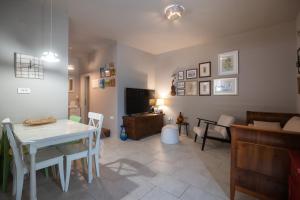 a living room with a white table and a couch at Holiday Home LI-ZA in Privlaka