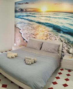 Postel nebo postele na pokoji v ubytování Nuovo bilocale a 100 mt dal mare