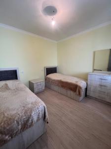 Postel nebo postele na pokoji v ubytování Guest House