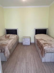 Postel nebo postele na pokoji v ubytování Guest House