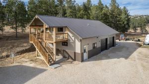 a modular home with a staircase and a house at Gold VC Custer`s Loft in Custer