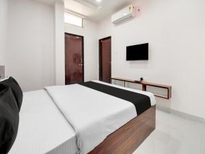 Кровать или кровати в номере OYO Hotel Atithi Inn