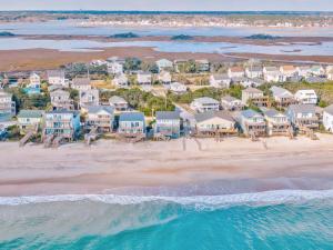 an aerial view of a beach with houses at A Grande Green in Surf City