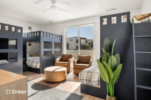 a bedroom with two bunk beds and a potted plant at Laguna Matata at Desert Color (by Ember Stays) in St. George +39 photos