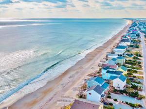 an aerial view of a beach with blue and white houses at A Grande Green in Surf City