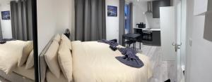 a living room with a bed and a kitchen at Studio in Oval London in Bellaghy