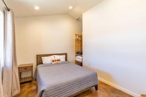a bedroom with a bed in a room at Gold Valley Camp Cabin 1 in Custer