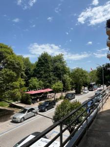 a street with cars parked in a parking lot at Mirelas guesthouse in Pogradec