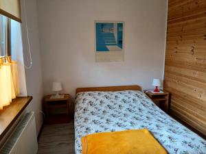 Postel nebo postele na pokoji v ubytování Apartamenty Jakob