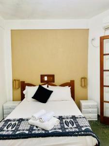 Een bed of bedden in een kamer bij Maresias Praia Hotel