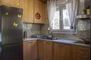Kuchyň nebo kuchyňský kout v ubytování Maria's House