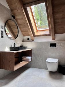 a bathroom with a sink and a mirror at Roubenka Pod hvězdami in Strážné