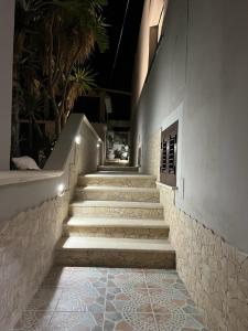a set of stairs leading up to a building at Mimma house in Lampedusa +20 photos