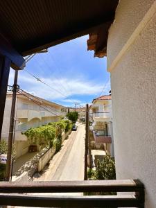 a view of a street from a balcony of a building at Elinor Pefkochori in Pefkohori