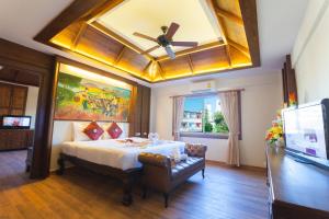 Ένα ή περισσότερα κρεβάτια σε δωμάτιο στο Nak Nakara Hotel