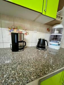 A kitchen or kitchenette at The Library Hostel