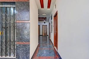 a corridor of a house with a door at Collection O SV Delight Inn in Hyderabad