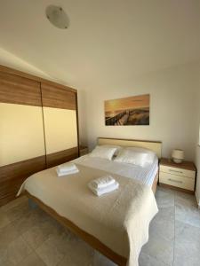 Postel nebo postele na pokoji v ubytování Apartmani Villa Adriatic