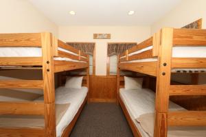 a bunk bed room with two bunk beds at Apple Blossom by Eden Crest in Pigeon Forge +24 photos