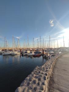 a marina with boats parked in the water at Maria Luxury Apartament Golf del Sur Tenerife in San Miguel de Abona