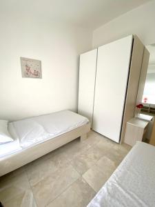 Postel nebo postele na pokoji v ubytování Apartmani Villa Adriatic