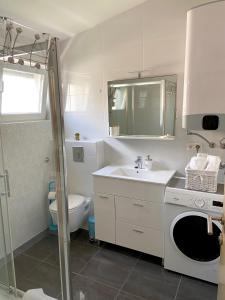 Kúpeľňa v ubytovaní Apartmani Villa Adriatic + 36 fotografií