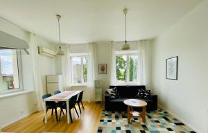 a living room with a couch and a table at Endla Hostel ja Apartamendid in Haapsalu