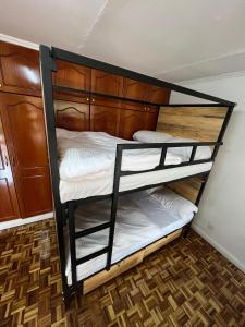 A bed or beds in a room at The Library Hostel