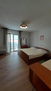 Postel nebo postele na pokoji v ubytování Apartments Anka Pag