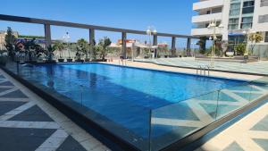 a large swimming pool in a building at Magnifique penthouse 160m2 terrasse 90m2 vue mer in Tangier