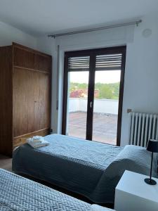 Postel nebo postele na pokoji v ubytování Casa Nello