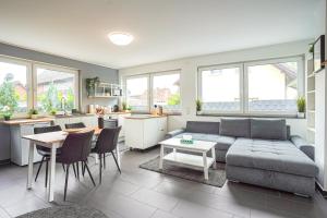 a living room with a couch and a table at Apartment Köln in Cologne